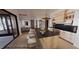 Illustration of a modern kitchen with a large island, sleek countertops, and stainless steel appliances at 4123 Rockingham Dr, Raleigh, NC 27609