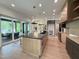 The spacious modern kitchen has a large island, sleek cabinets, and high-end appliances at 4123 Rockingham Dr, Raleigh, NC 27609