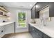 Bright laundry room features plenty of storage with modern fixtures at 4123 Rockingham Dr, Raleigh, NC 27609