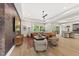 Bright living space featuring hardwood floors, decorative lighting, a comfortable seating area, and backyard views at 4123 Rockingham Dr, Raleigh, NC 27609