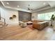 Spacious living room with hardwood floors, accent wall, recessed lighting, and large sectional sofa at 4123 Rockingham Dr, Raleigh, NC 27609