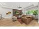 Spacious living room features recessed lights, a decorative wall, and a comfortable, oversized sectional sofa at 4123 Rockingham Dr, Raleigh, NC 27609