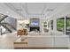 Bright living room with modern fireplace, high ceiling, and open layout to staircase at 4123 Rockingham Dr, Raleigh, NC 27609