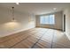 Spacious living room with large windows, recessed lighting, and modern pendant lights at 4123 Rockingham Dr, Raleigh, NC 27609