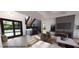 Illustration of a modern living room featuring a fireplace, open staircase, and ample natural light at 4123 Rockingham Dr, Raleigh, NC 27609