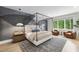 Serene main bedroom featuring a four-poster bed, stylish rug, and natural light at 4123 Rockingham Dr, Raleigh, NC 27609