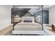 Beautiful main bedroom with a stylish four-poster bed and designer decor at 4123 Rockingham Dr, Raleigh, NC 27609