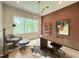 Bright home office with a large window, modern desk, stylish chair, and unique decor at 4123 Rockingham Dr, Raleigh, NC 27609
