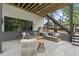 Covered patio area with outdoor seating, ideal for relaxation and entertaining at 4123 Rockingham Dr, Raleigh, NC 27609