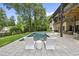 Resort style pool with lounge chairs with a view of the backyard and home at 4123 Rockingham Dr, Raleigh, NC 27609