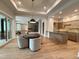 Recreation room with poker table and game area alongside a fully equipped kitchen at 4123 Rockingham Dr, Raleigh, NC 27609