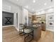 Stylish wet bar area with modern cabinets, a dark countertop, and seating for two at 4123 Rockingham Dr, Raleigh, NC 27609