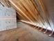 Spacious attic with exposed wood beams and plywood flooring ready for storage or conversion at 165 Inspiration Way, Fuquay Varina, NC 27526