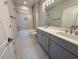 Modern bathroom featuring a double sink vanity, tiled shower, and stylish finishes at 165 Inspiration Way, Fuquay Varina, NC 27526