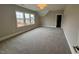 Spacious bedroom with plush carpeting and plenty of natural light at 165 Inspiration Way, Fuquay Varina, NC 27526