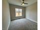 Spacious bedroom with plush carpeting and plenty of natural light at 165 Inspiration Way, Fuquay Varina, NC 27526