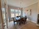 Bright dining room with modern chandelier and natural light at 165 Inspiration Way, Fuquay Varina, NC 27526