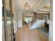 Welcoming foyer showcases hardwood floors and staircase at 165 Inspiration Way, Fuquay Varina, NC 27526