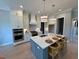Bright, contemporary kitchen with stainless steel appliances and generous counter space at 165 Inspiration Way, Fuquay Varina, NC 27526