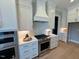 Close up of a modern kitchen with stainless steel appliances and lots of cabinets at 165 Inspiration Way, Fuquay Varina, NC 27526