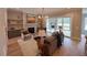 Cozy living room with fireplace, built-in shelving, and seamless flow to outdoor living space at 165 Inspiration Way, Fuquay Varina, NC 27526