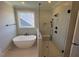 Bathroom with soaking tub and walk-in shower at 183 Inspiration Way, Fuquay Varina, NC 27526