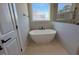 Bathroom with soaking tub and walk-in shower at 183 Inspiration Way, Fuquay Varina, NC 27526