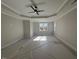 Spacious bedroom with ceiling fan and large windows at 183 Inspiration Way, Fuquay Varina, NC 27526