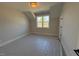 Spacious bedroom with window and carpet at 183 Inspiration Way, Fuquay Varina, NC 27526