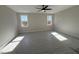 Large bedroom with two windows and ceiling fan at 183 Inspiration Way, Fuquay Varina, NC 27526