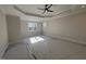Spacious bedroom with ceiling fan and large windows at 183 Inspiration Way, Fuquay Varina, NC 27526