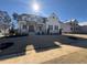 Two story home with white siding, stone accents, and a large front yard at 183 Inspiration Way, Fuquay Varina, NC 27526