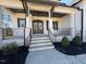 Elegant front entry with stone accents and double doors at 183 Inspiration Way, Fuquay Varina, NC 27526