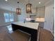Island kitchen with white cabinets and quartz countertops at 183 Inspiration Way, Fuquay Varina, NC 27526