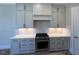 Modern kitchen with stainless steel appliances and white cabinets at 183 Inspiration Way, Fuquay Varina, NC 27526