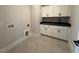 Laundry room with cabinets and a utility sink at 183 Inspiration Way, Fuquay Varina, NC 27526