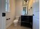 Powder room with toilet and modern vanity at 183 Inspiration Way, Fuquay Varina, NC 27526