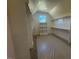Spacious walk-in closet with built-in shelving and hanging rods at 183 Inspiration Way, Fuquay Varina, NC 27526