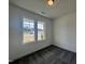 Neutral bedroom with natural light provided by energy-efficient windows with views of the outdoors at 189 Waterwheel Dr, Selma, NC 27576