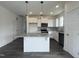 Bright kitchen featuring stainless appliances, ample counter space and a central kitchen island at 189 Waterwheel Dr, Selma, NC 27576