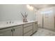 Double vanity bathroom with shower and quartz countertop at 35 Uptown Rd, Zebulon, NC 27597