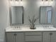 Double vanity bathroom with quartz countertops and a large walk in shower at 35 Uptown Rd, Zebulon, NC 27597