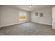 Bedroom with large window and neutral wall colors at 35 Uptown Rd, Zebulon, NC 27597
