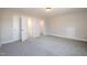 Bedroom with carpet flooring, closet, and access to another room at 35 Uptown Rd, Zebulon, NC 27597