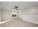 Spacious bonus room with carpeted floors and a ceiling fan at 35 Uptown Rd, Zebulon, NC 27597