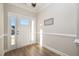 Bright foyer features a white front door with glass and light-colored walls at 35 Uptown Rd, Zebulon, NC 27597