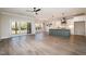 Open-concept living space with access to a back deck, eat-in island, and modern finishes at 35 Uptown Rd, Zebulon, NC 27597