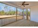 Screened porch with wooden deck and wooded views at 35 Uptown Rd, Zebulon, NC 27597