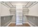 Walk-in closet with ample shelving and hanging space for organized storage at 35 Uptown Rd, Zebulon, NC 27597