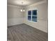 Bright dining room with hardwood floors and wainscoting at 120 Watermelon Dr, Franklinton, NC 27525